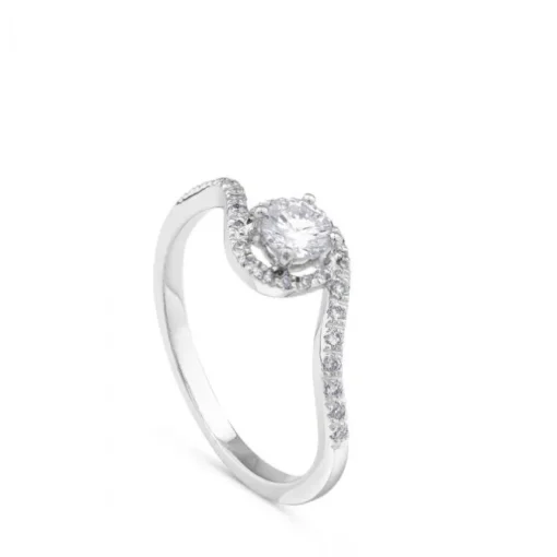 Solitario de oro blanco de 0,29 quilates engastado en 4 garras con orla de pavé de brillantes