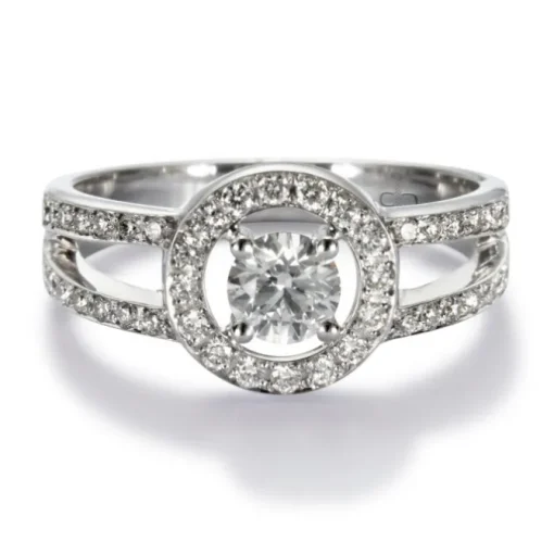 Solitario "Martina" de oro blanco con diamante central en 4 garras, orla y montura de diamantes