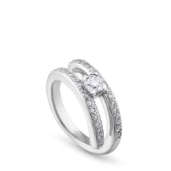 Solitario "Twins" de oro blanco con diamante central 0.27 quilates en garra y pavé en montura