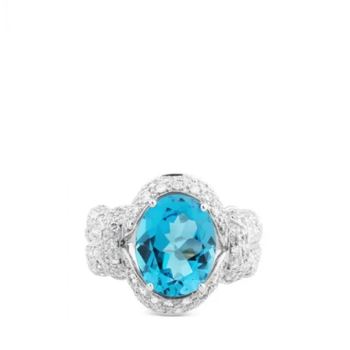 Sortija de oro blanco con topacio azul oval y pavé de diamantes