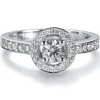 Sortija "María Valentina" de oro blanco con diamante central en 4 garras de 0.32 quilates, orla y montura de diamantes