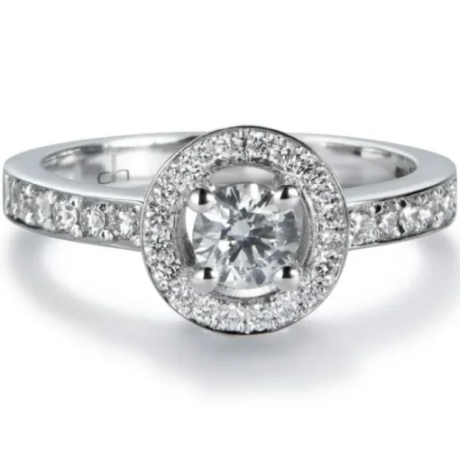 Sortija "María Valentina" de oro blanco con diamante central en 4 garras de 0.32 quilates, orla y montura de diamantes